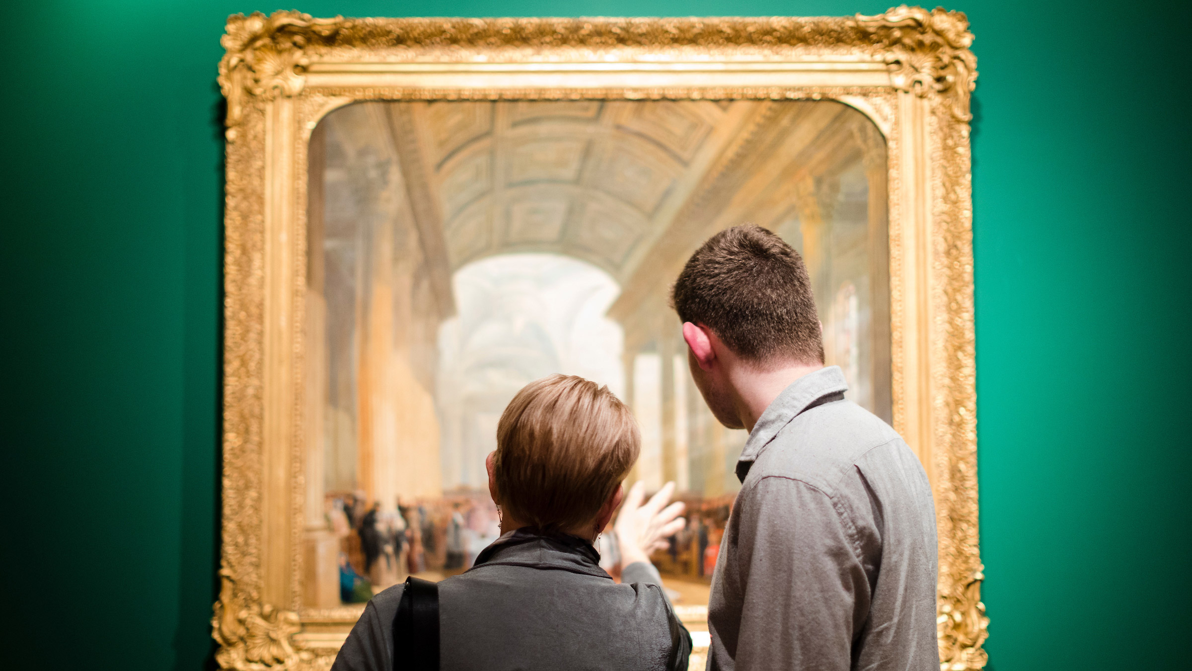 A mother and son view one of the paintings on display at Ireland's Great Hunger Museum.